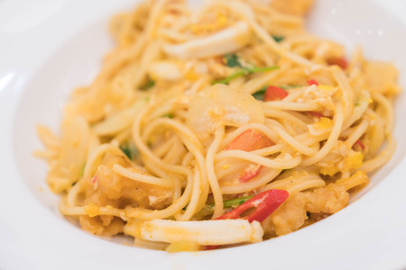 pan fried spaghetti with seafood curryの写真素材