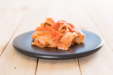 kimchi on wood background - korean foodの写真素材