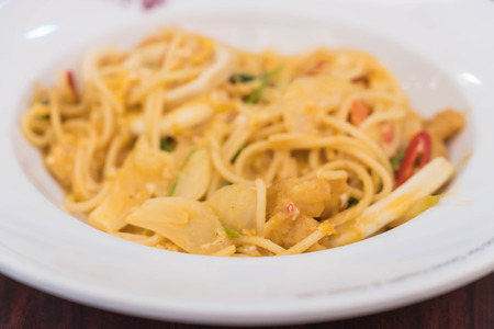 pan fried spaghetti with seafood curryの写真素材