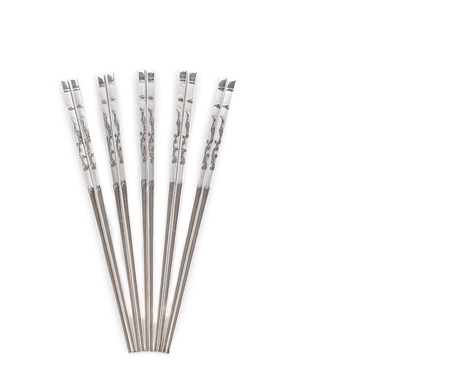 A set of Korean flat metal chopsticks on white backgroundの写真素材
