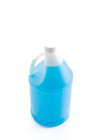 Bottle of blue cleaning detergent on a white background.の写真素材