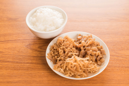 Boiled rice or mush with Pickled radishの写真素材