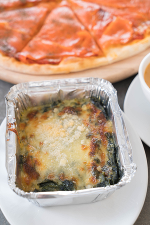 baked spinach  with smoked salmon pizza and lobster soupの写真素材