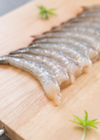 fresh shrimp/prawn on wood boardの写真素材