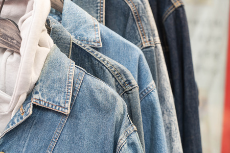 Clothes hang on a shelfの写真素材