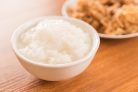 Boiled rice or mush with Pickled radishの写真素材