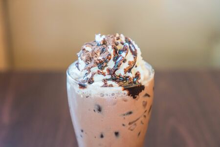chocolate frappe with cream topping in glassの写真素材