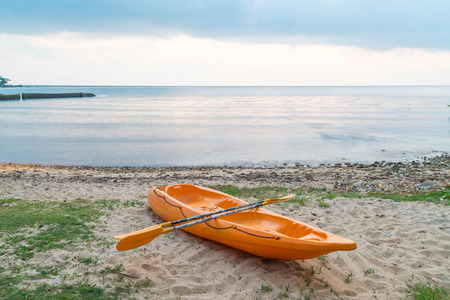 Canoe on beach and seaの写真素材