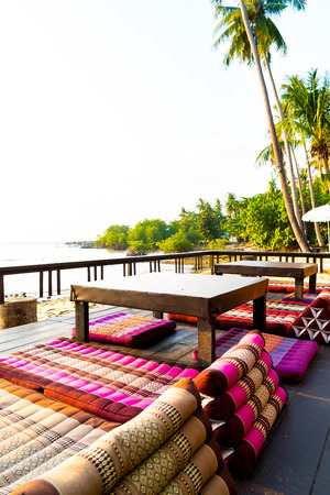 Sunset with umbrella deck chair pool - vintage filter effectの写真素材