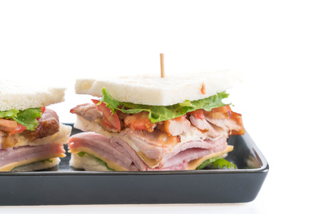 chicken and ham sandwich on white backgroundの写真素材
