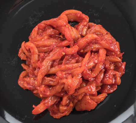 squid kimchi on white backgroundの写真素材