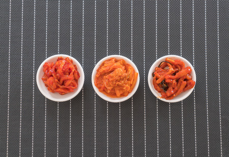 Chinese cabbage, squid and radish kimchi on the tableの写真素材