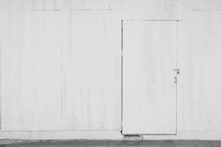 white door on construction buildingの写真素材