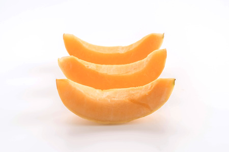 fresh cantaloupe on white backgroundの写真素材