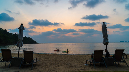 Sunset with umbrella deck chair pool -  boost up color processingのeditorial素材