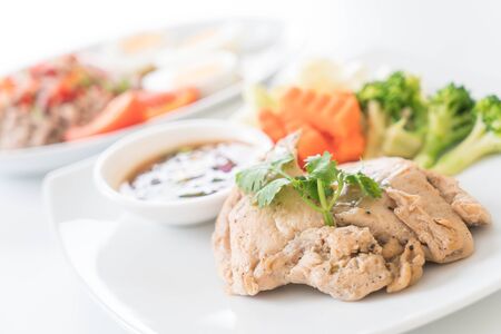 Grilled chicken with spicy sauceの写真素材