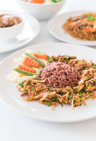 Hot and Spicy Grilled Pork Salad with Berry Riceの写真素材