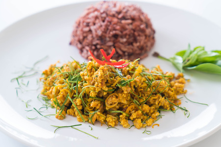 Stir Fried Minced Pork with Hot Yellow Curry and berry riceの写真素材