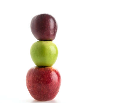 green and red apples on white backgroundの写真素材