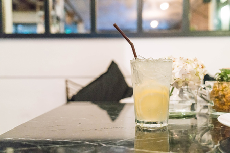 Glass of soda with a lemon. Selective focusの写真素材