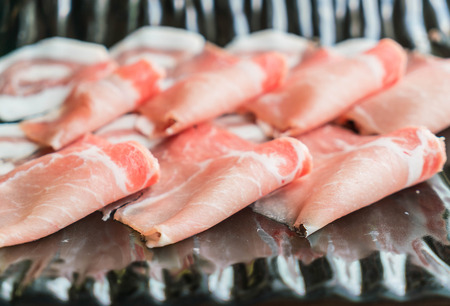 Slide raw meat on the tableの写真素材