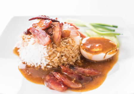 Barbecued red pork in sauce with riceの写真素材