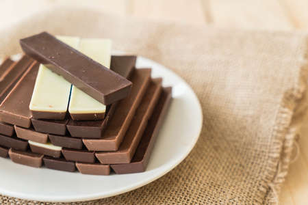 chocolate bars on wood background