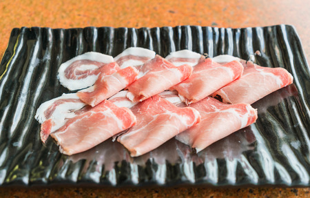 Slide raw meat on the tableの写真素材