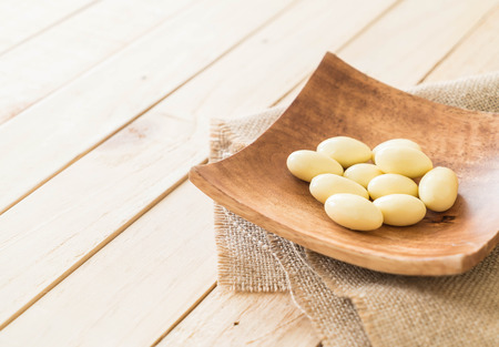 white chocolate ball on wood plateの写真素材