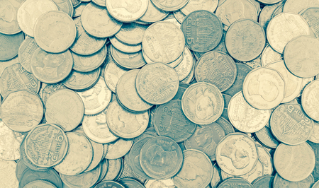 Close up and selective focus point on coin textures - vintage effect
