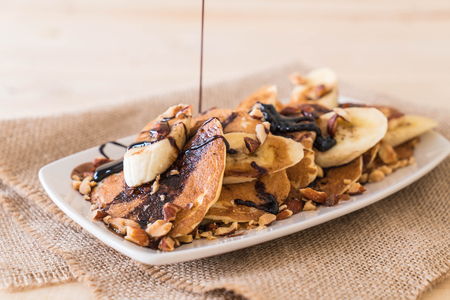 almond banana pancake with chocolate syrupの写真素材