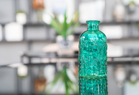glass bottle decoration on the table in living room