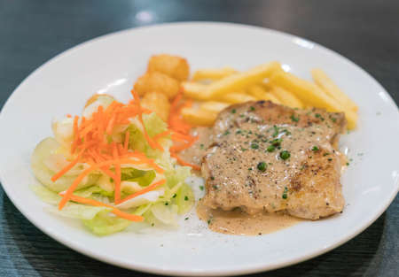 chicken steak with peppers sauceの写真素材