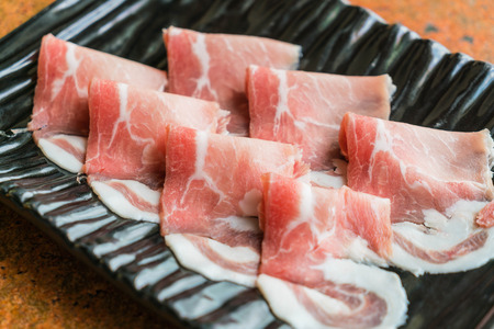 Slide raw meat on the tableの写真素材