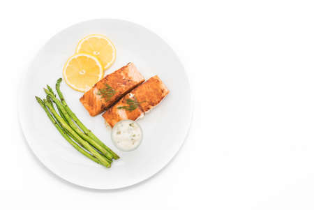 grilled salmon steak on white backgroundの写真素材