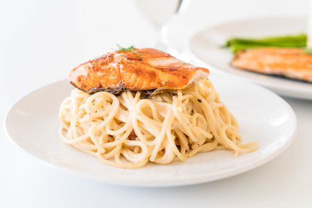 spaghetti cream sauce with grilled salmonの写真素材
