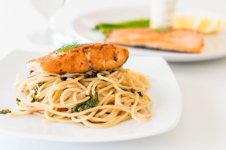 stir-fried spicy spaghetti with grilled salmonの写真素材