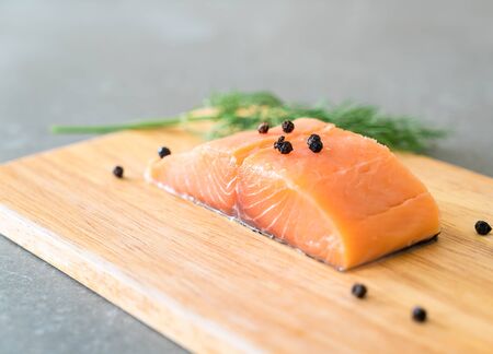 Fresh Salmon Fillet on board  with black peppersのeditorial素材