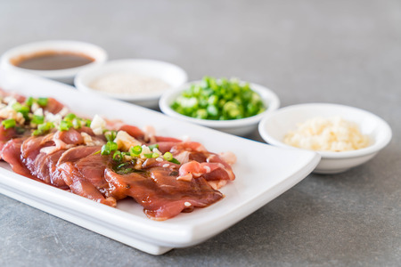 fresh pork sliced with ingredientsの写真素材