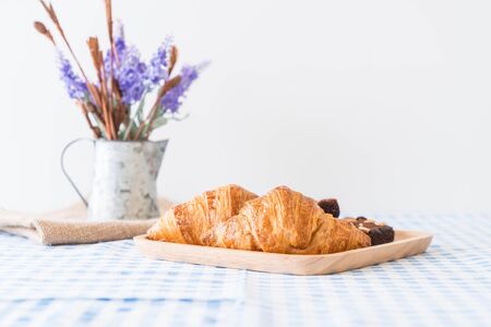 croissant and brownies on tableの写真素材