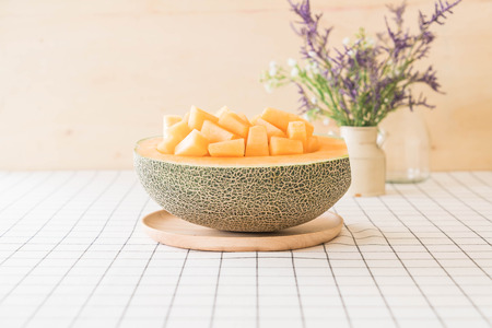fresh cantaloupe melon for dessert on table