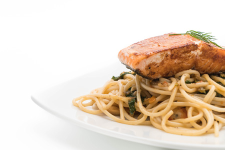 stir-fried spicy spaghetti with grilled salmonの写真素材