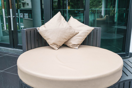 Beautiful luxury outdoor patio with pillow on sofa decoration in hotel resortの写真素材