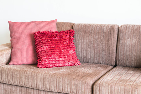 Beautiful pillow on sofa decoration in living room interiorの写真素材