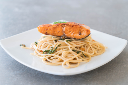 stir-fried spicy spaghetti with grilled salmonの写真素材