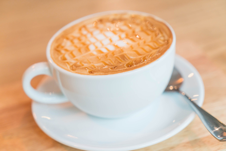 hot caramel macchiato in coffee shopの写真素材