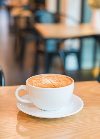 hot caramel macchiato in coffee shopの写真素材