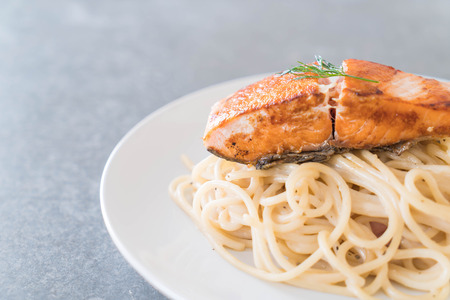 spaghetti cream sauce with grilled salmonの写真素材