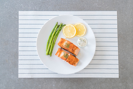 grilled salmon steak on the tableの写真素材