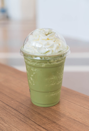 green tea latte frappe on tableの写真素材